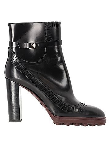 Tod's Tod's Buckled Lasercut Glossed Ankle Boots in Black Leather (view 1)