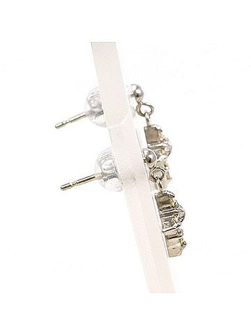 Unbranded 18K (18-karat white gold) earrings with two 0.05mm yellow diamonds. Total weight approximately 1.1g. Jewelry. (view 2)