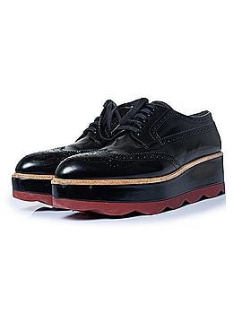 Prada Prada, shiny leather broque platform sneakers (view 1)
