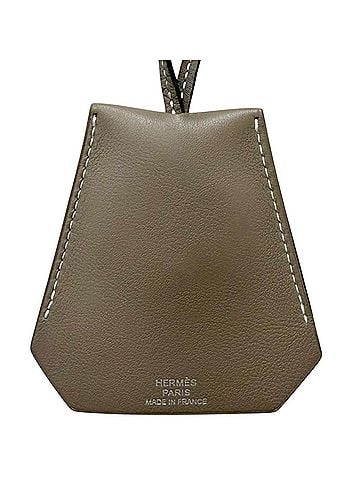 Hermès HERMES Large Leather Clochette Necklace in Veau Swift, Etoupe, with C stamp, Made France, Men's/Women's. (view 1)