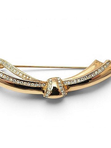 Christian Dior Christian Dior pin brooch, ribbon motif, gold rhinestones. (view 1)