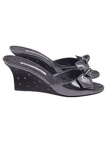 Manolo Blahnik Manolo Blahnik Bow Wedge Mules in Black Leather (view 1)